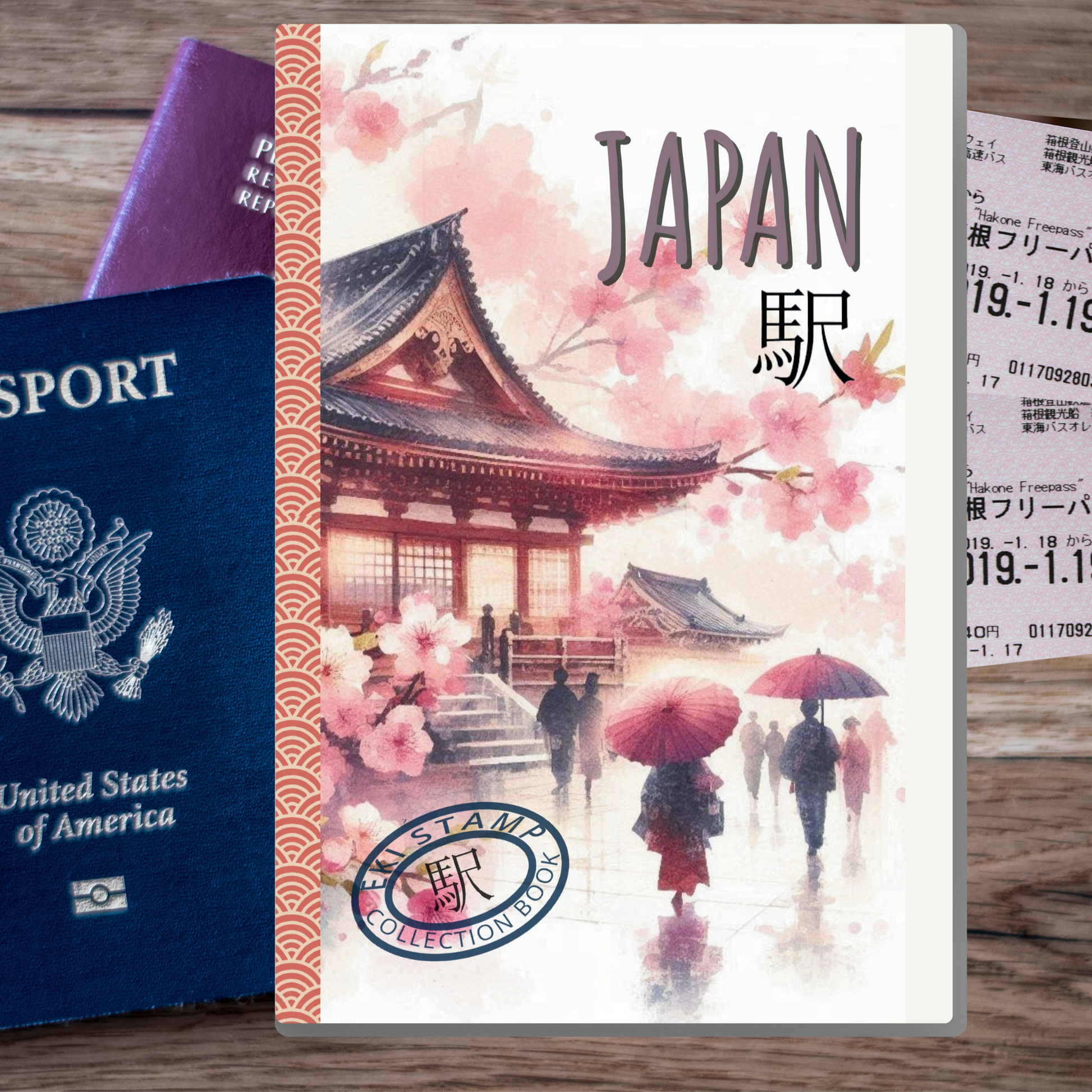 Book titled 'Japan' with cherry blossoms and people under umbrellas, next to a U.S. passport on a wooden surface.