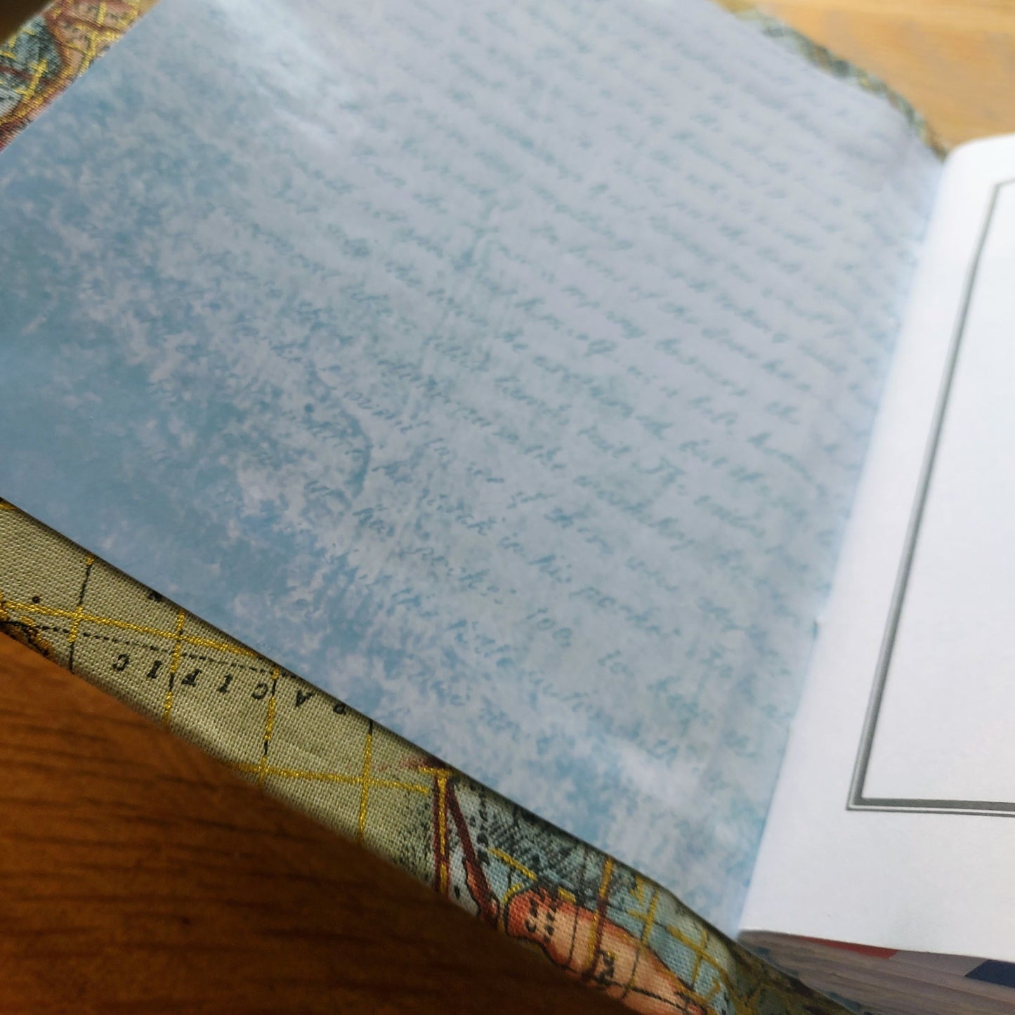 interior cover of fabric covered hardback travel journal. protective metal book corners