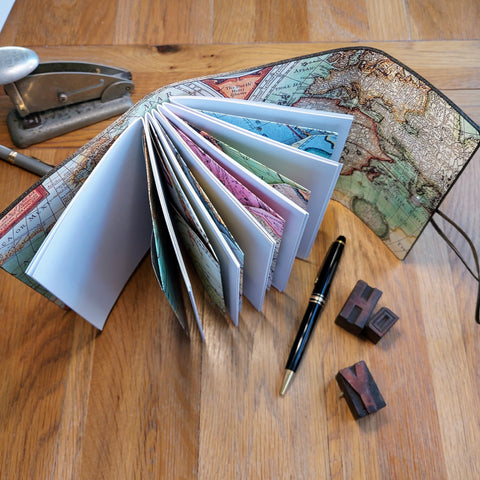 Trifold wraparound journal in rustic leather with 6 envelopes in vintage map prints