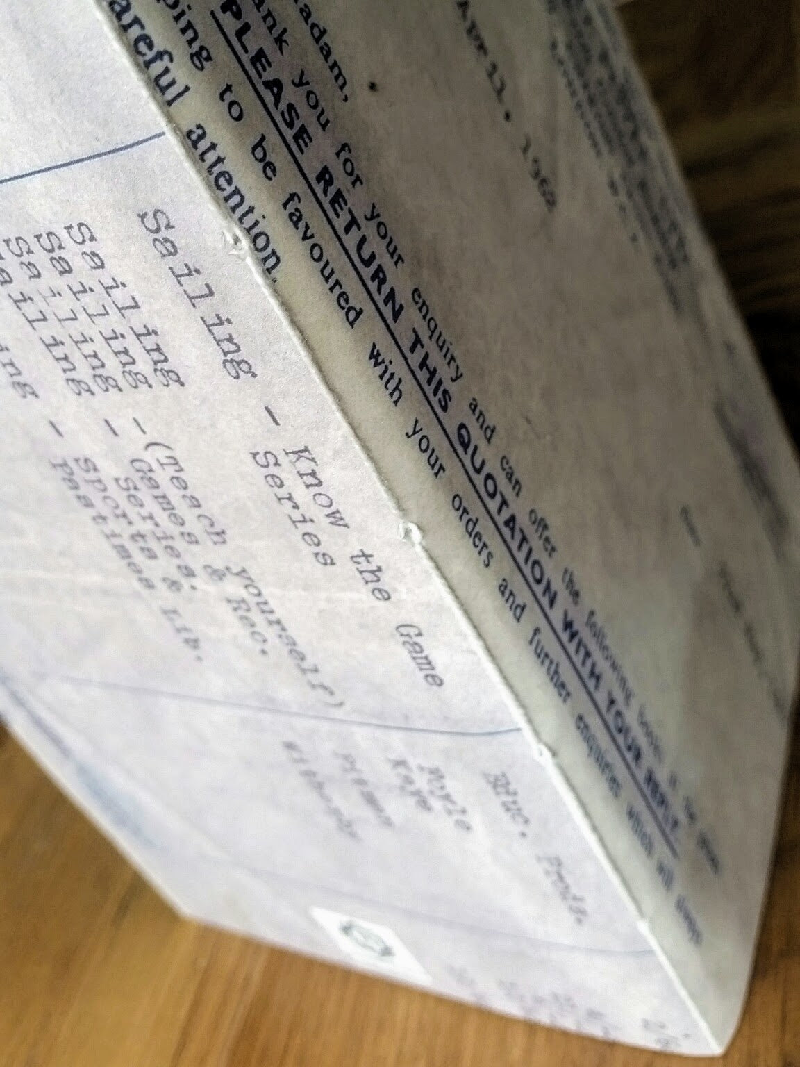 Spine view of junk journal notebook insert with vintage invoice image