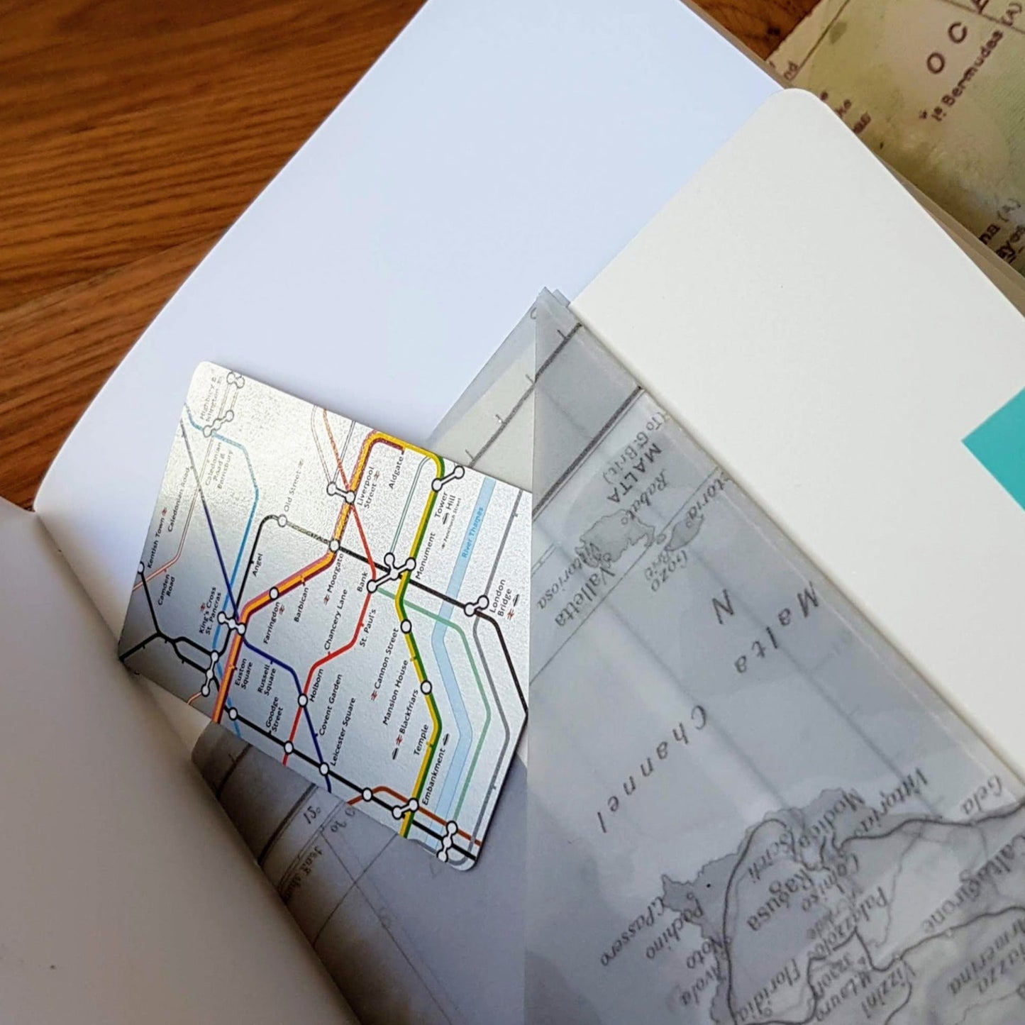 MAp print transparent triple pocket inside a leather A5 travel journal. London underground map features