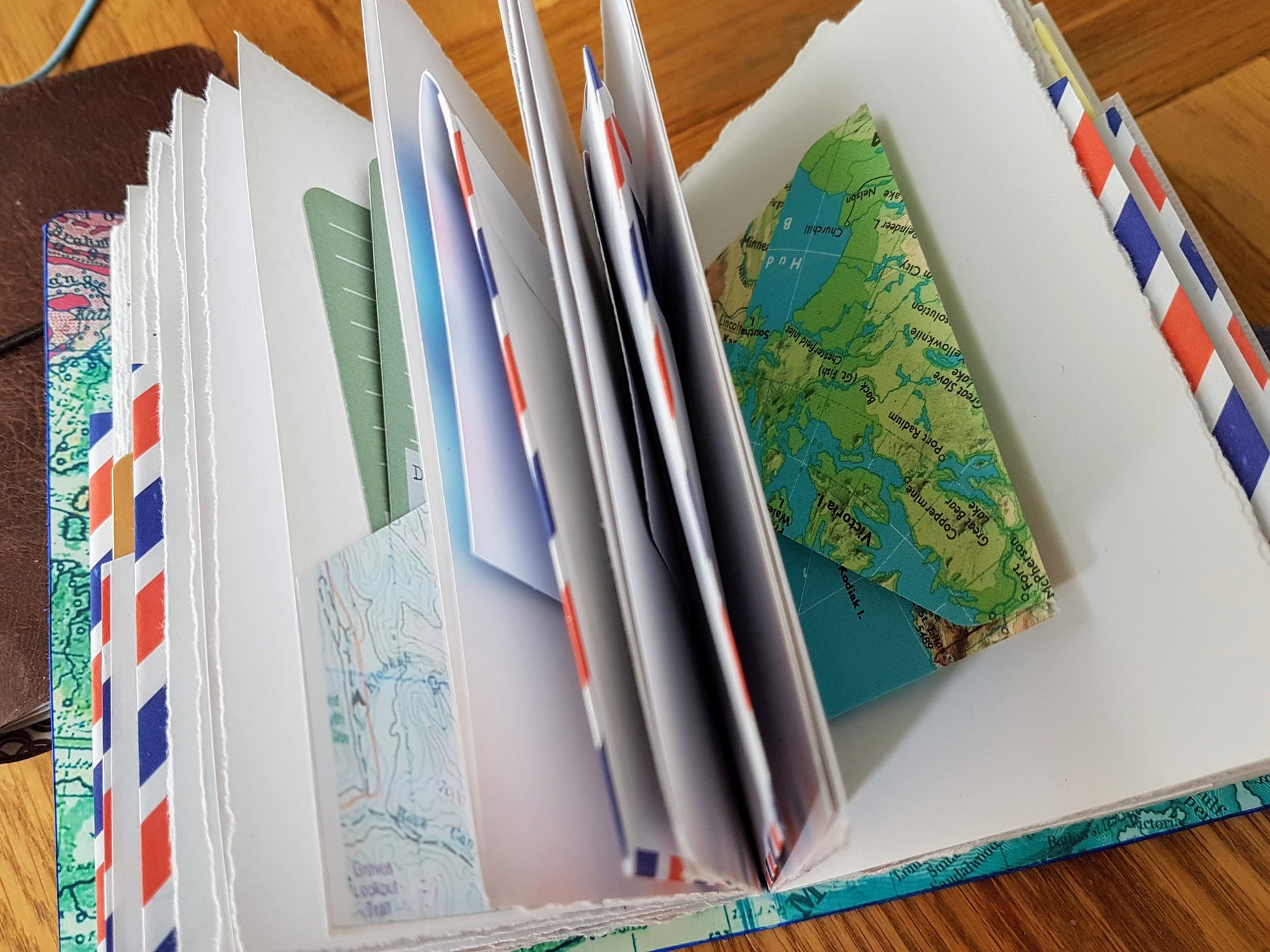 envelope pocket pages inside bespoke bindery travel journals