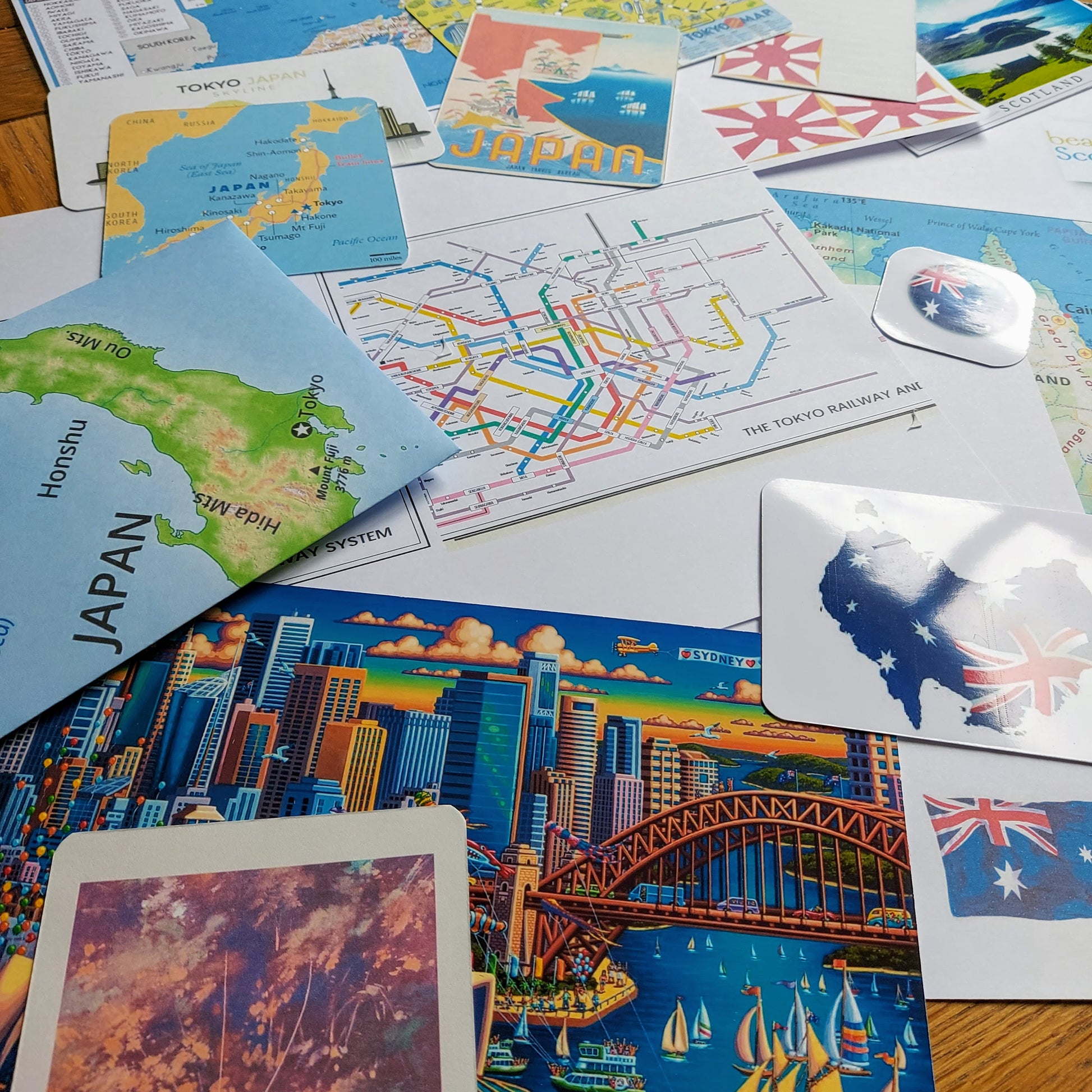 Images used when adding a destination theme to leather travel journal showing maps and images of Japan Australia
