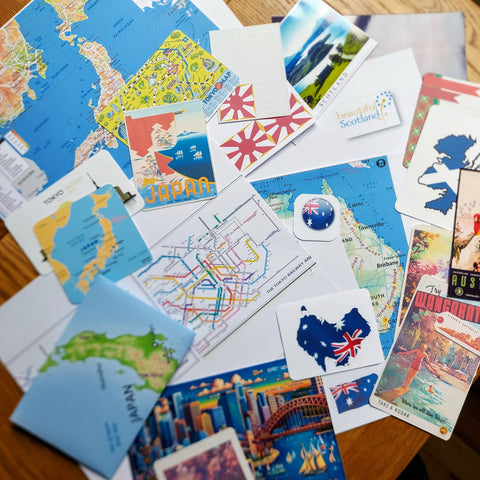 Images used when adding a destination theme to leather travel journal showing maps and images of Japan Australia and Scotland