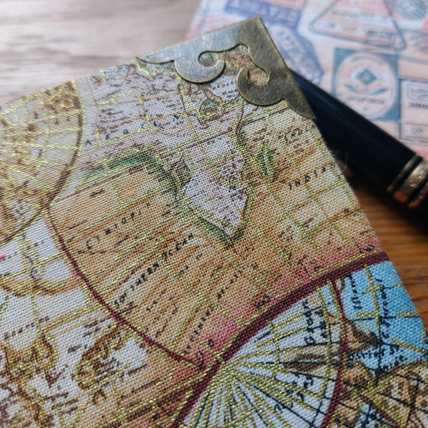 metal protective book corners on hardback fabric covered travel journal .  Golf highlights to vintage map images
