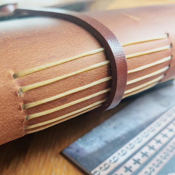 Rustic pull up leather in golden brown with handstitched signatures