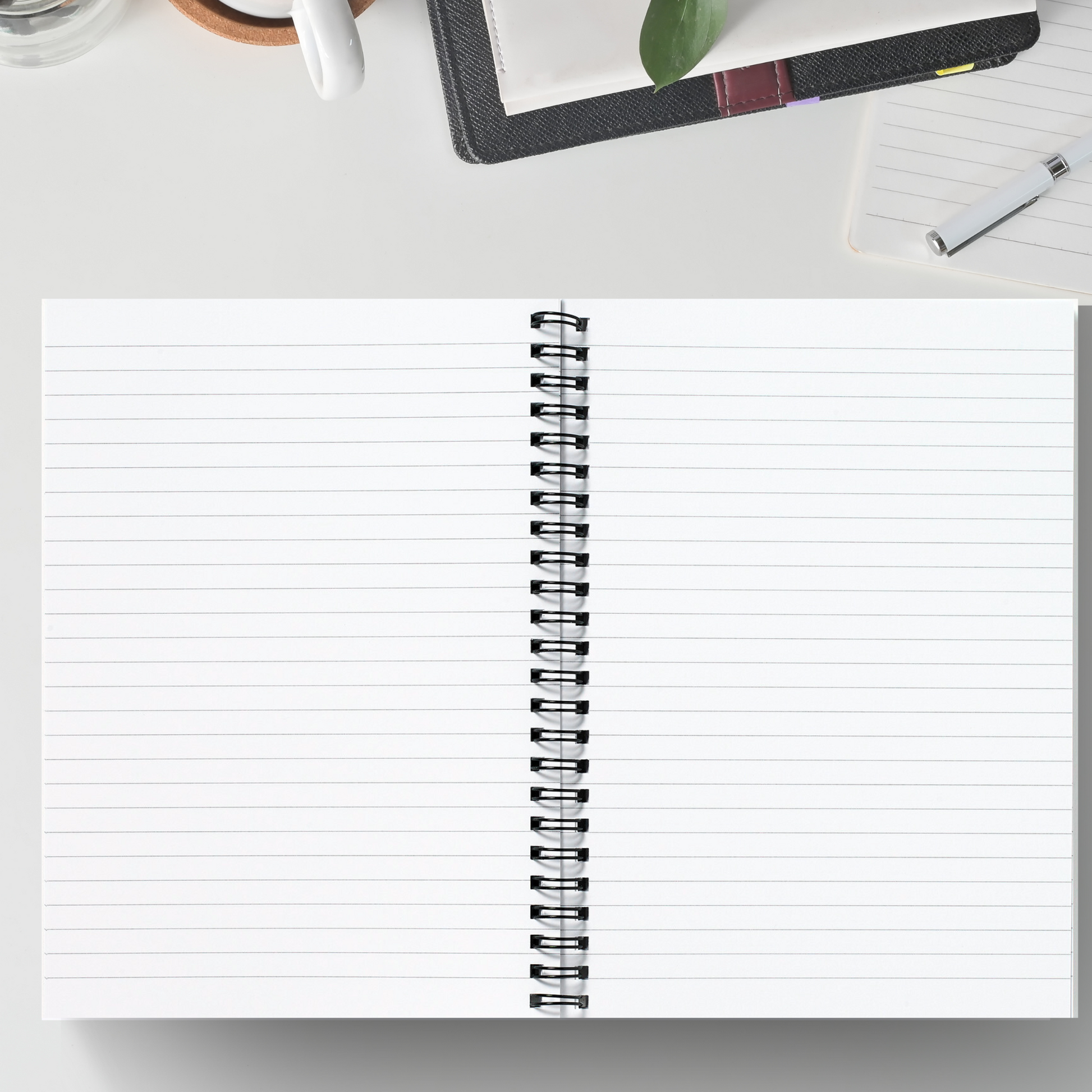 Open spiral bound notebook with lined pages