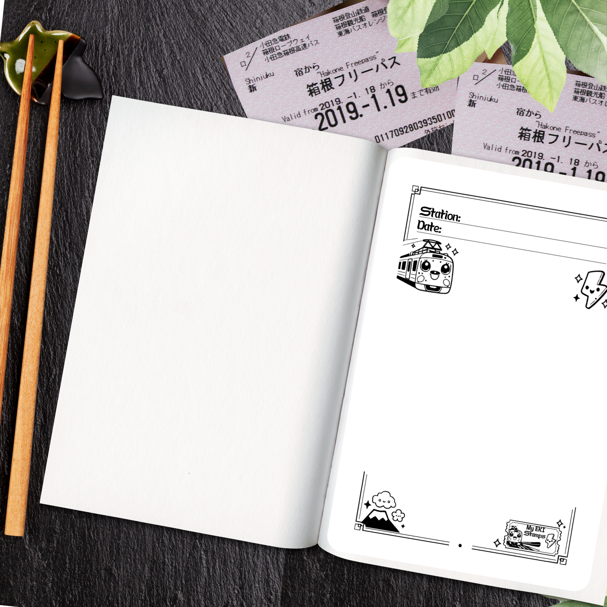 Open notebook with illustrations of japanese trains on a dark surface with chopsticks and train tickets.