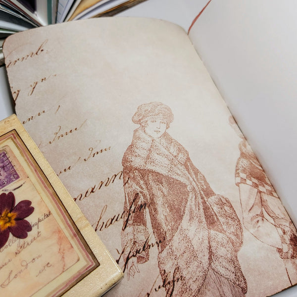 inside cover with rustic vintage image of a victorian lady with calligraphy edge