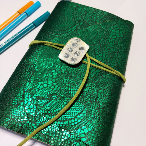 intense green wrap around cover mixed paper journal art notebook.  Fastens with a large white button and green suede lace
