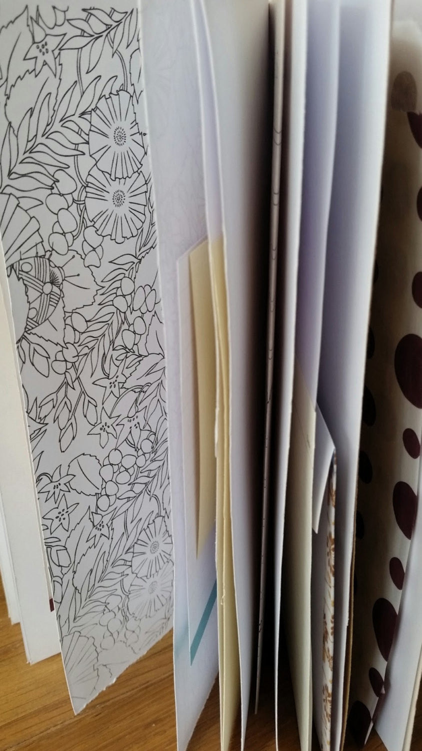 Variety of paper pages in a junk journal by Bespoke Bindery