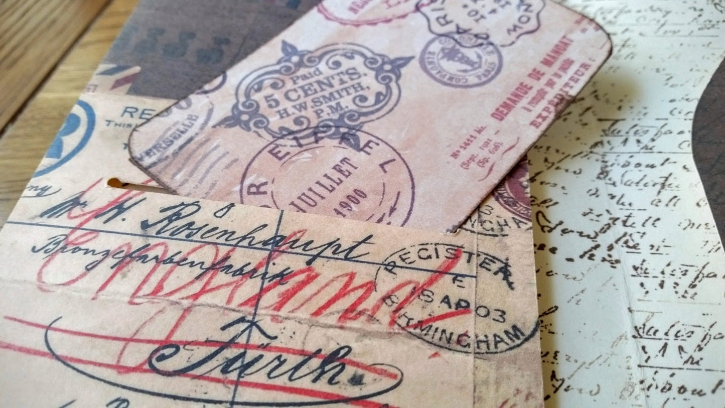 Close up of vintage envelope printed onto inside pocket of TN dashboard.  Shows card slot and hand stamped handwriting interior