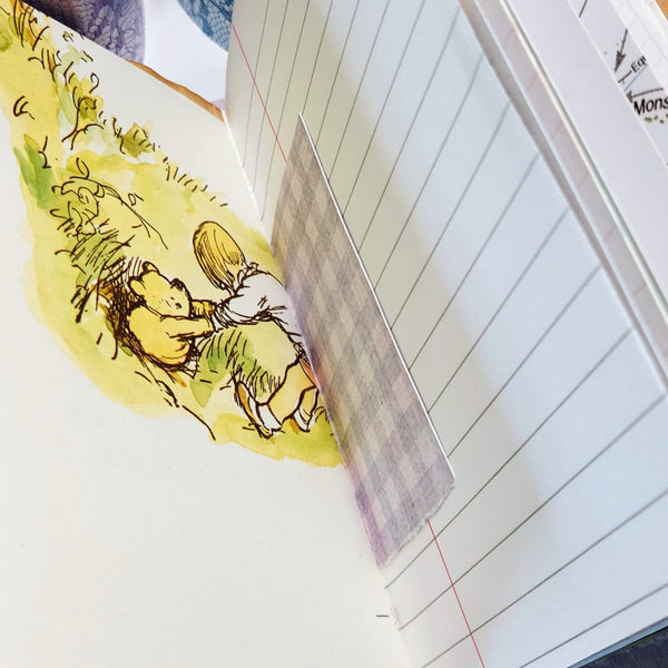 interior pages of a mixed paper journal with image of christopher robin and pooh bear