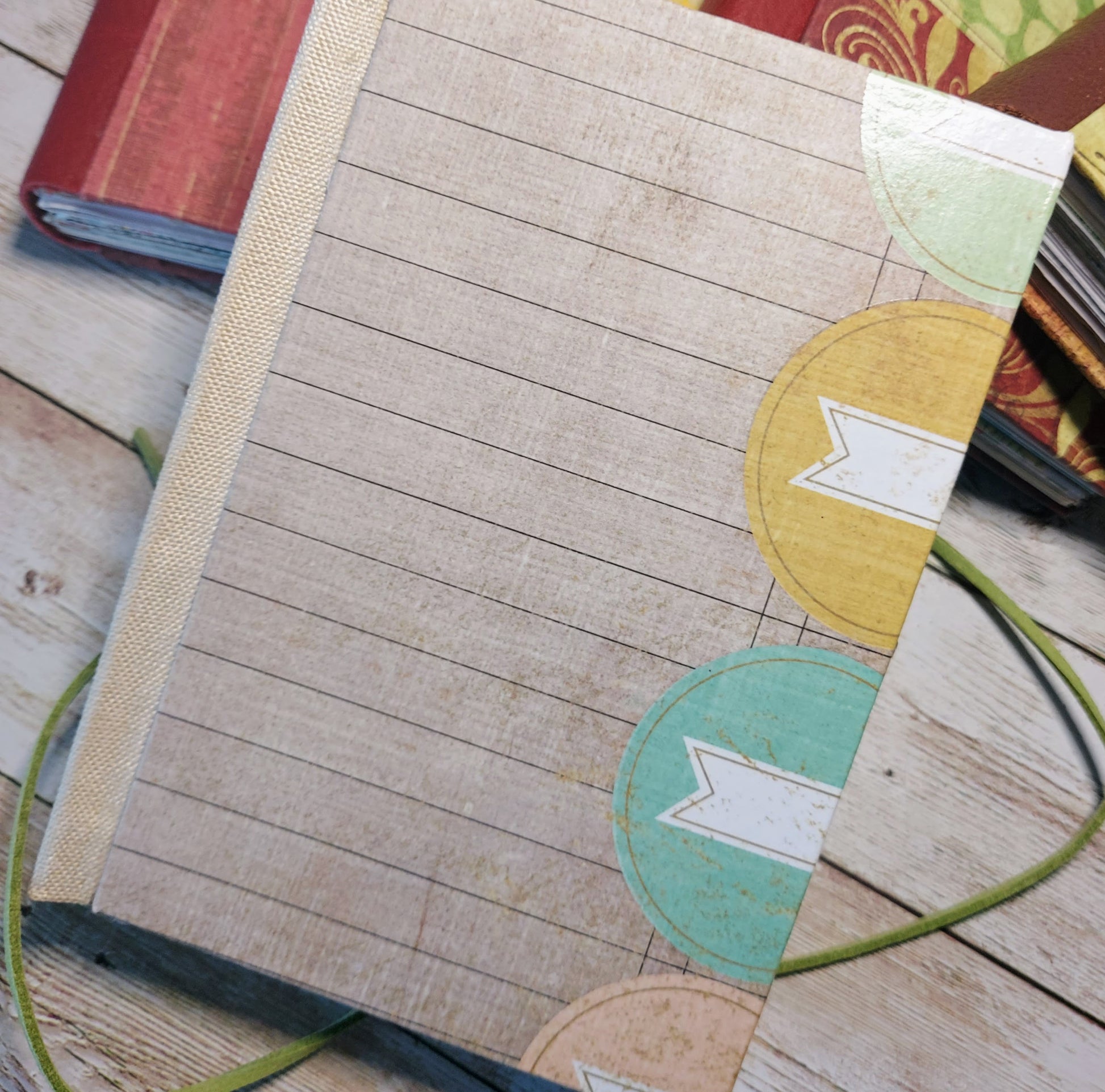  junk journal mixed paper Notebook with decorative covers on a wooden surface