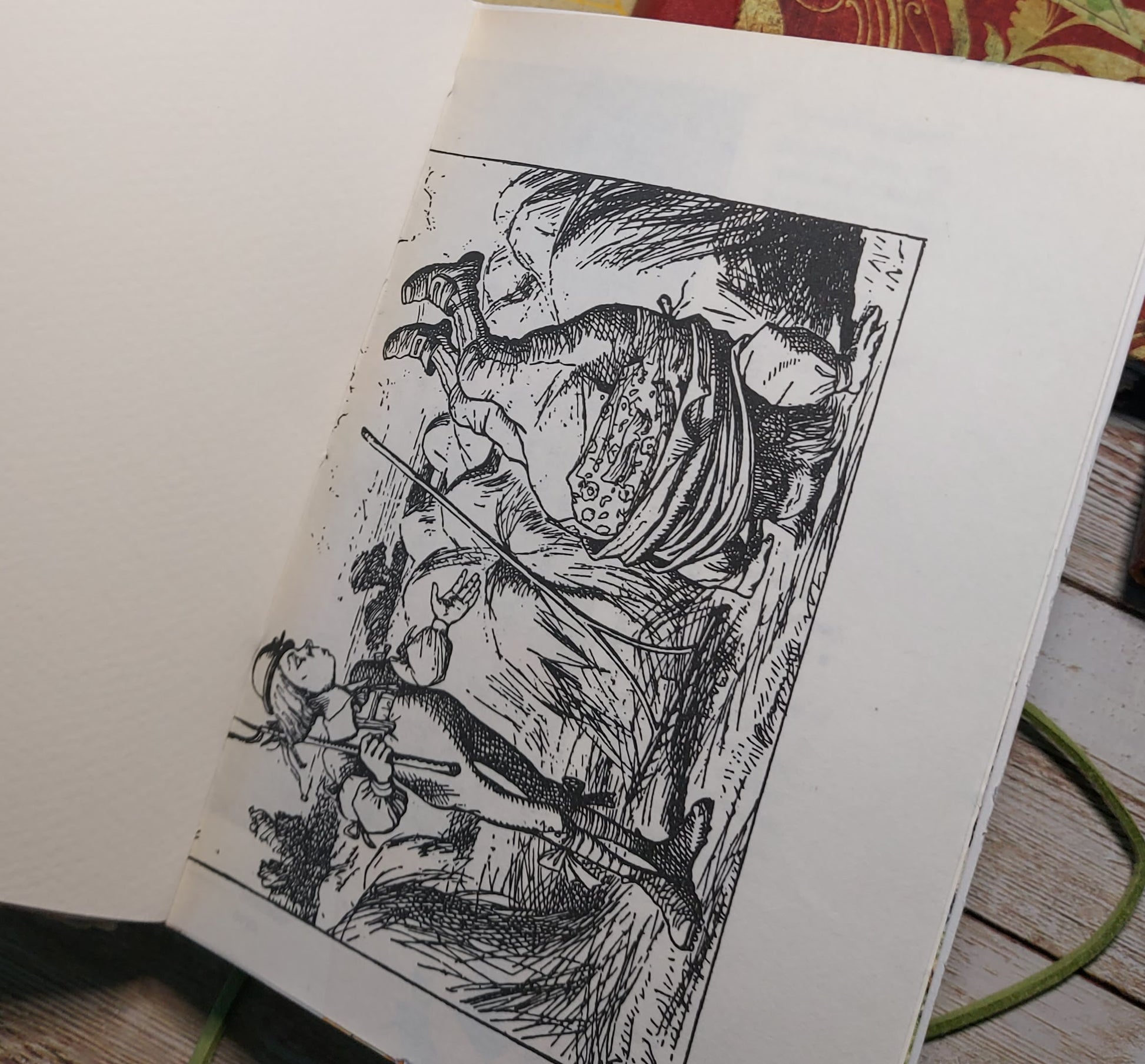 Illustration from alice in wonderland book inside  junk journal mixed paper notebook