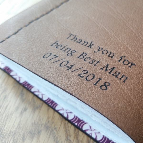 Long laser etched message to groomsman on back of leather golf journal