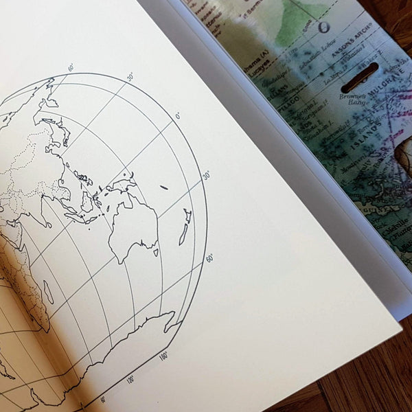 blank world map double page in large leather travel journal