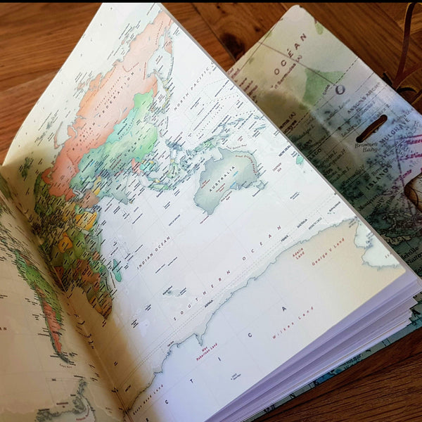 World map double page in large leather travel journal