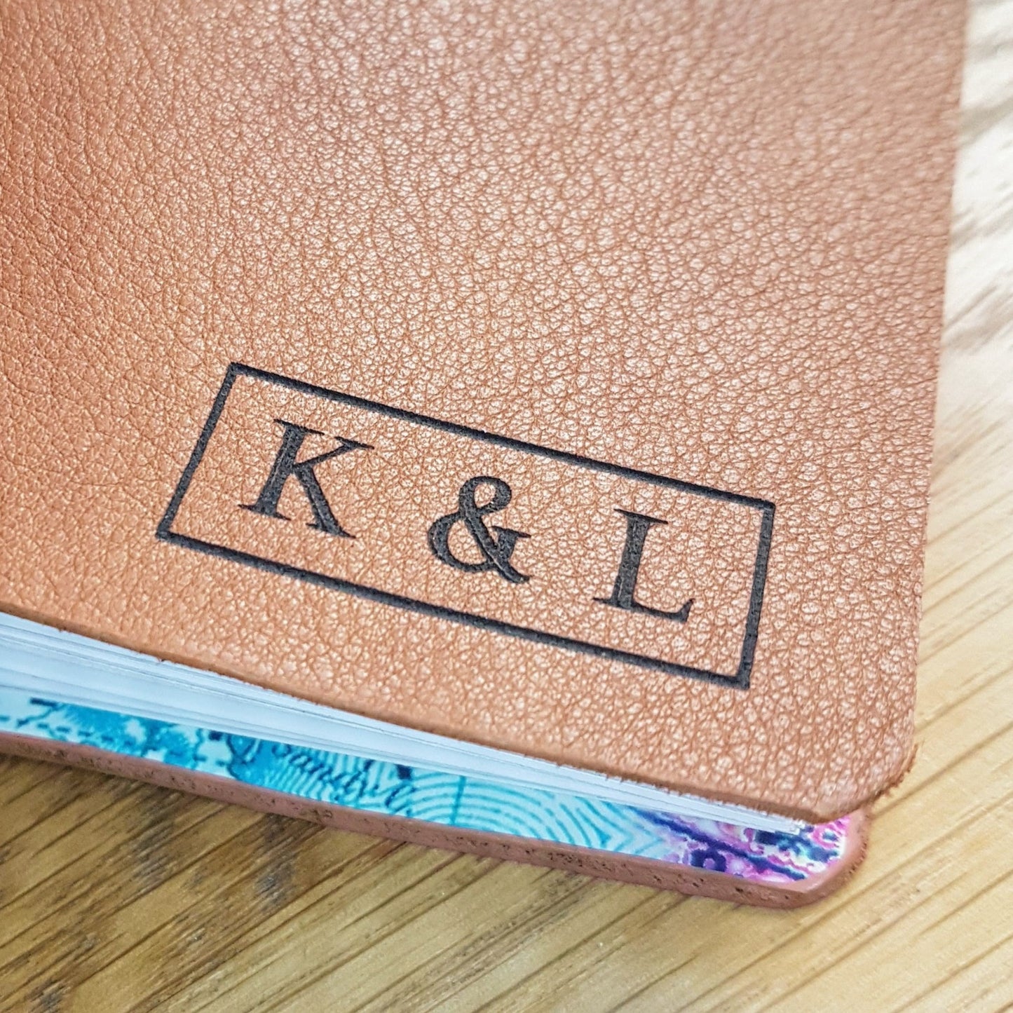 add laser engraved  initials to the front of a travel journal