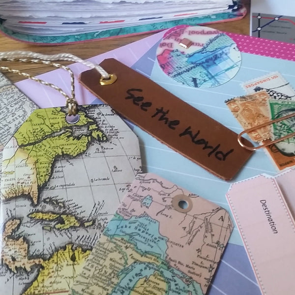 tags and stamps in a bespoke bindery leather travel journal