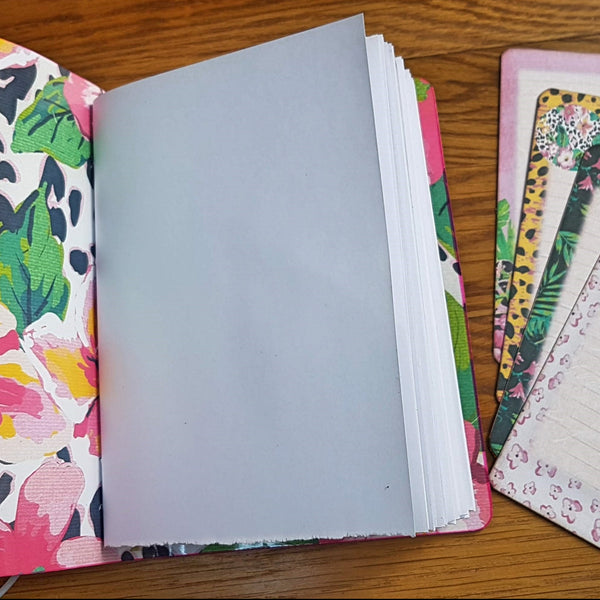 A6 size leather journal lined with large hawaiin floral print, bright white hand torn pages and 4 journaling cards in co-ordinating prints