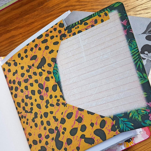 Yellow pink and black design on envelope and hawaii themed flora on journaling card