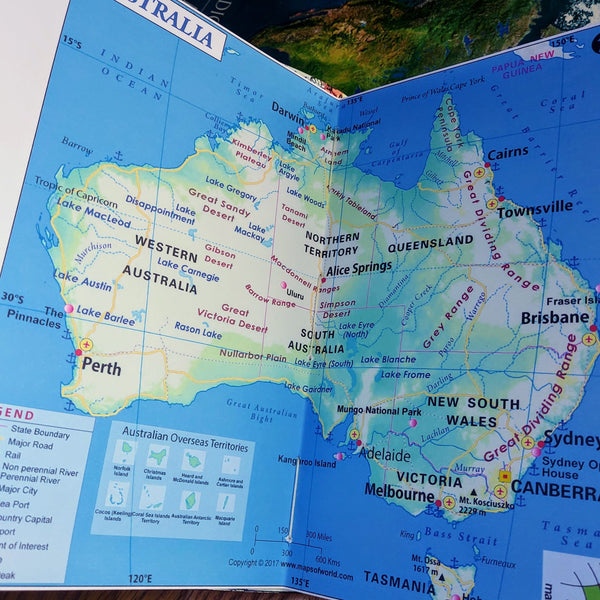 Blue map of Australia inside themed travel journal