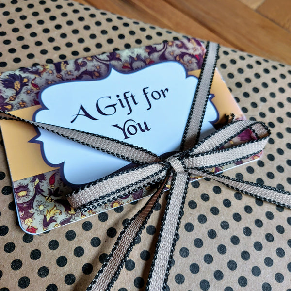 add a gift message to your golf gift set tucked behind the ribbon