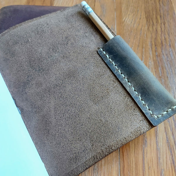 hand stitched leatherhandstitched pencil pocket inside back cover of  hunting shooting journal in waxed leather
