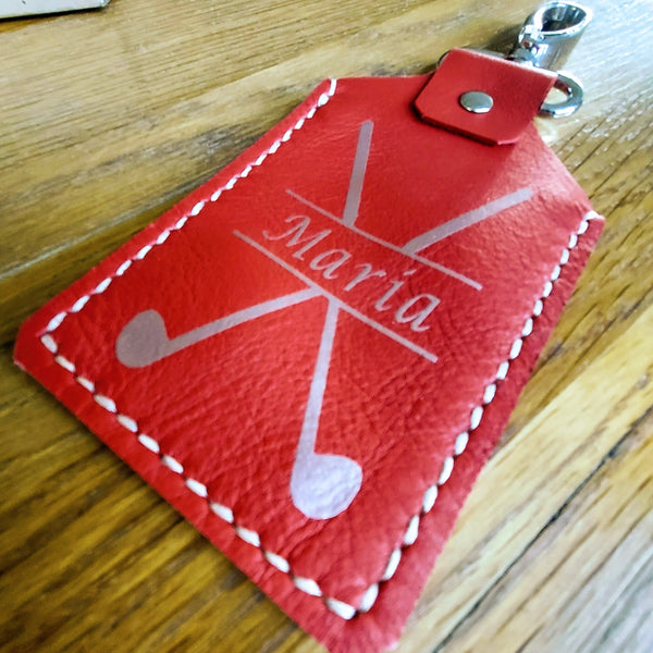 Red leather golf tee holder saddlestitched by hand with silver personalisation and silver nickel fixings