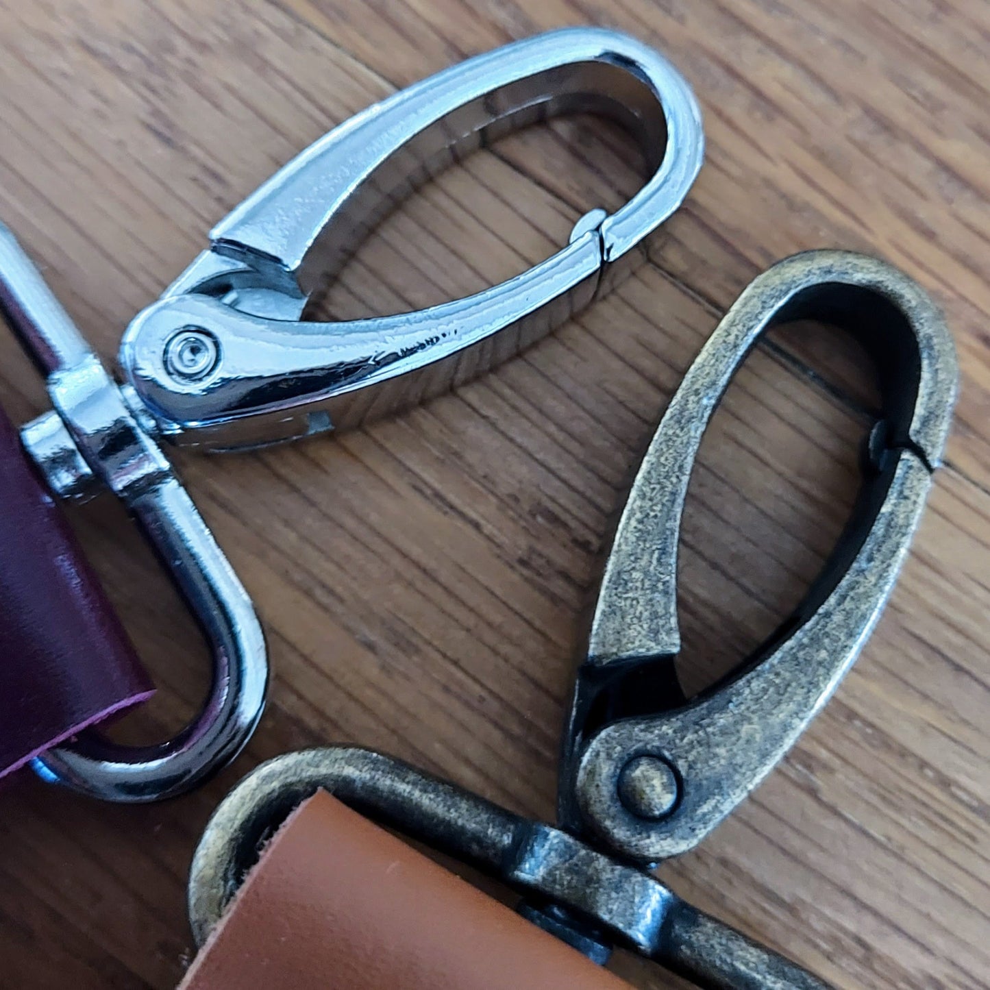 silver nickel and antique brass lobster clips on leather golf tee holders