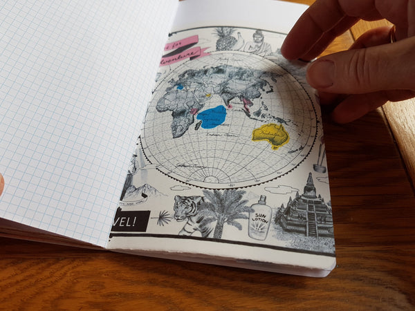 World map art in travel map junk journal by Bespoke Bindery