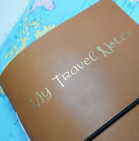 My Travel Notes gold foil personalisatrion to front of golden brown leather TN cover