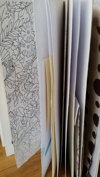 Variety of paper pages in a junk journal by Bespoke Bindery