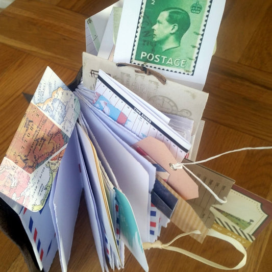 Compact leather travel journal with many inserts and cards