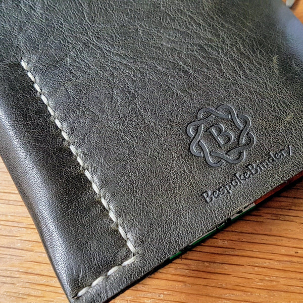 bespoke bindery branding to the back of leather golf journal